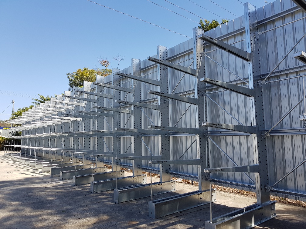 Outdoor hot-dip galvanised cantilever racking alongside an industrial building